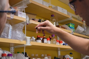 Hand with vial in lab