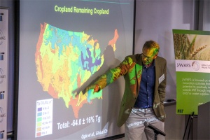 Man presenting slide with map of America