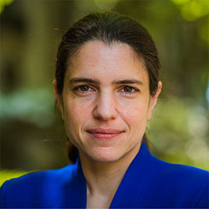 Headshot of Heather J. Kulik, standing outside in a blue blazer