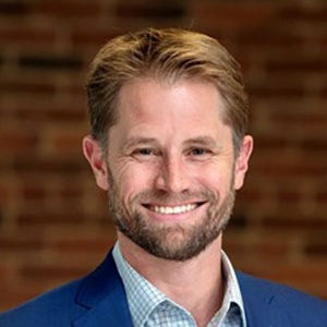 Brent Boehlert, white man in blue suit