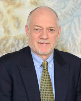 Timothy Manning Swager standing in a suit and tie