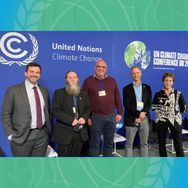 Four men and one women at an event during COP26 in October of 2021