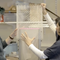 Diana Yousef and her team pull a net piece off of an evaporative toilet