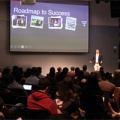Man presenting presentation called "Roadmap to Success"